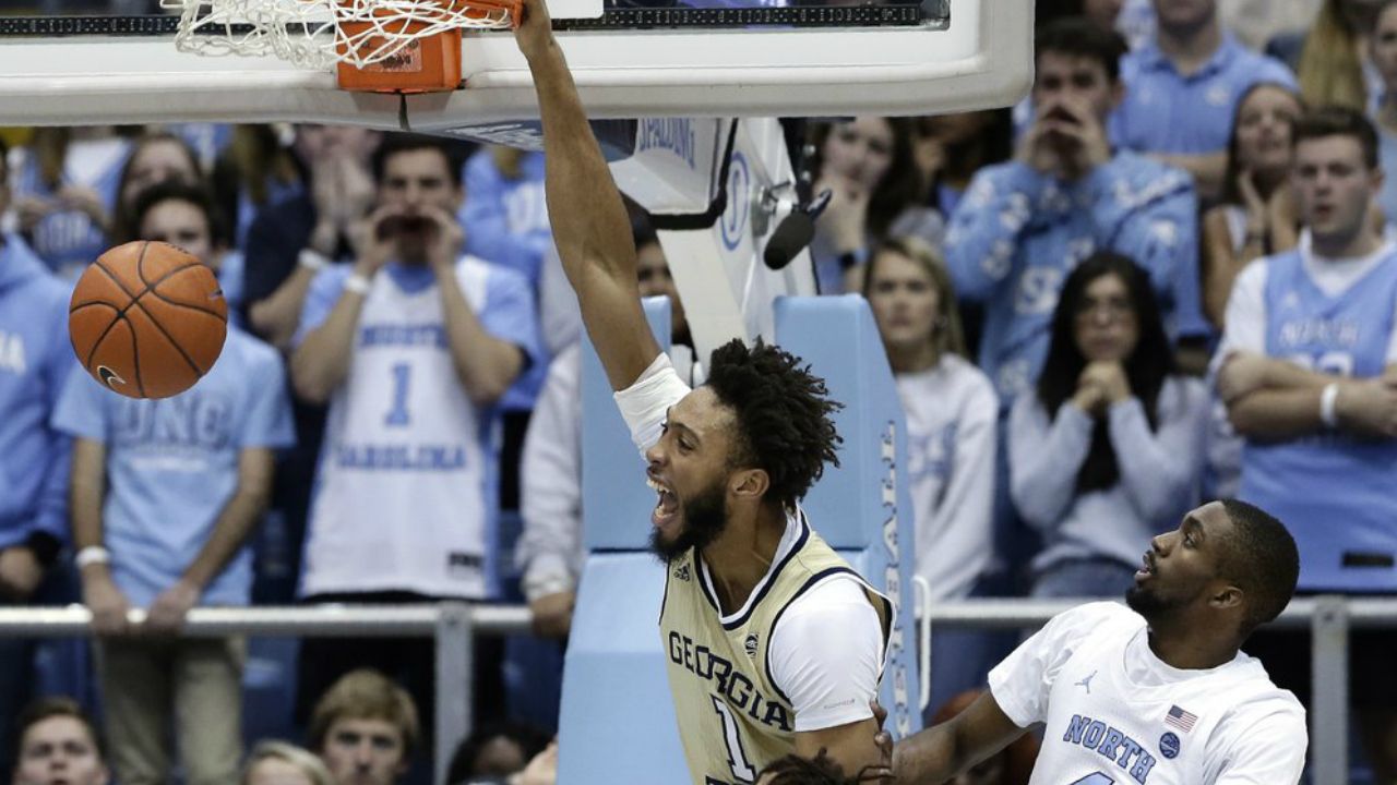 Georgia Tech forward James Banks III (1) dunks next to North Carolina guard Brandon Robinson (4) during the first half of an NCAA college basketball game in Chapel Hill, N.C., Saturday, Jan. 4, 2020.