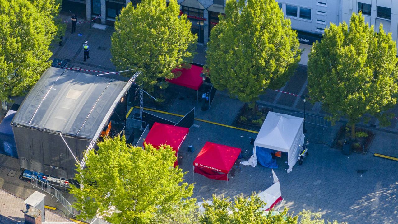 Emergency services tents stand in front of the stage in Solingen city center, Germany, Saturday Aug. 24, 2024, after three people were killed and at least eight people were wounded in a knife attack Friday night at the festival. (Christoph Reichwein/dpa via AP)