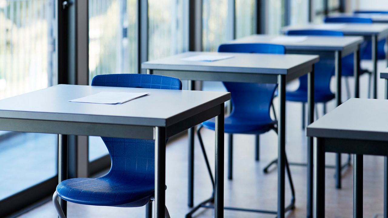 Desks in an empty classroom. (Getty Images)