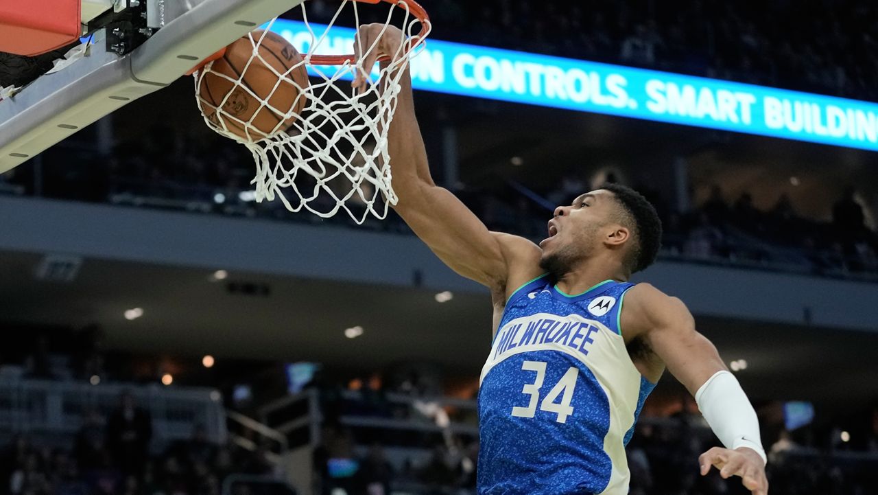 Milwaukee Bucks' Giannis Antetokounmpo dunks during the second half of an NBA basketball game