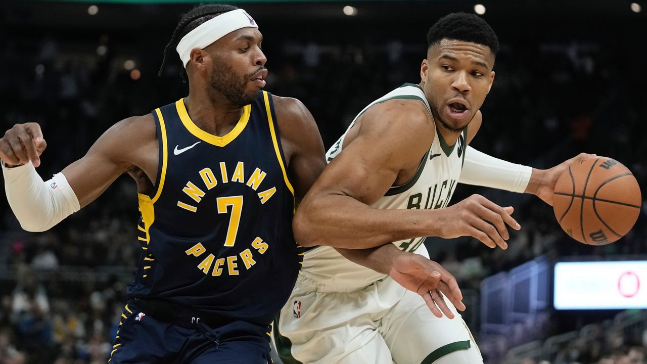 Milwaukee Bucks' Giannis Antetokounmpo drives by Indiana Pacers' Buddy Hield