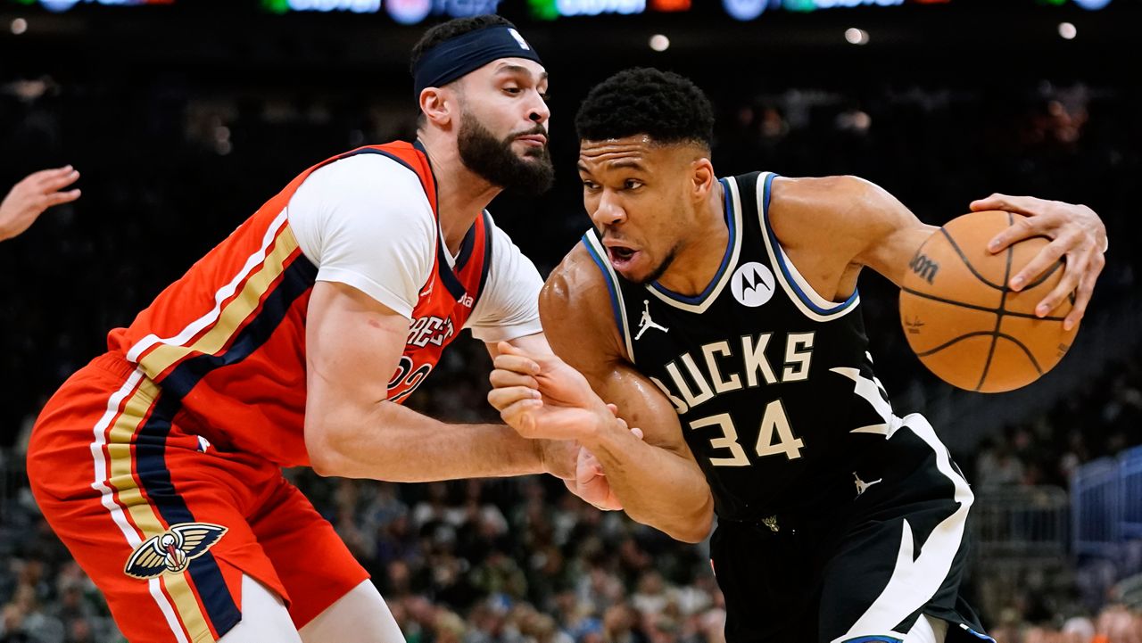 Milwaukee Bucks' Giannis Antetokounmpo (34) drives to the basket against New Orleans Pelicans' Larry Nance Jr.