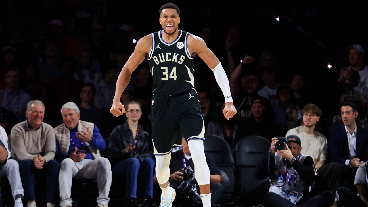 Milwaukee Bucks forward Giannis Antetokounmpo (34) celebrates after making a basket during the first half of a semifinal game against the Atlanta Hawks 