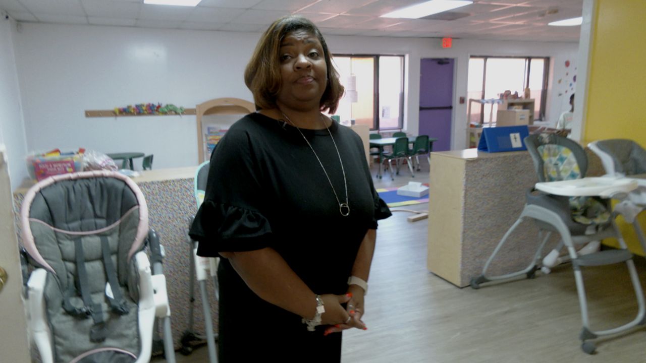 Longtime educator Tavia Gibson stands in her new learning academy after she decided to leave the public school system. (Spectrum News 1/Brian Scott)