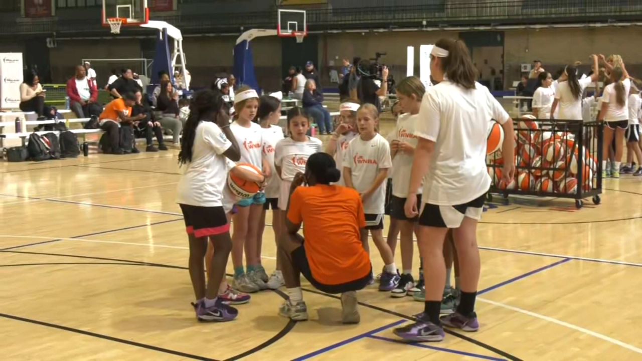 Girls shoot hoops at Jr. WNBA basketball clinic in Brooklyn