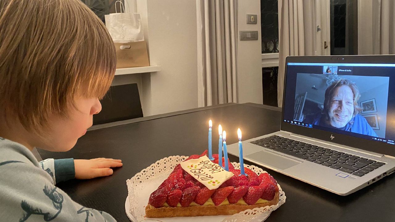 Andrea De Giorgi, on Zoom, virtually celebrates the fourth birthday of his son, Giulio, who was born on Valentine's Day. De Giorgi lives in Tallahassee, Fl. while his family remains in Italy, delayed by a pandemic-related ban on legal immigration. (Courtesy Stefania Martucci)