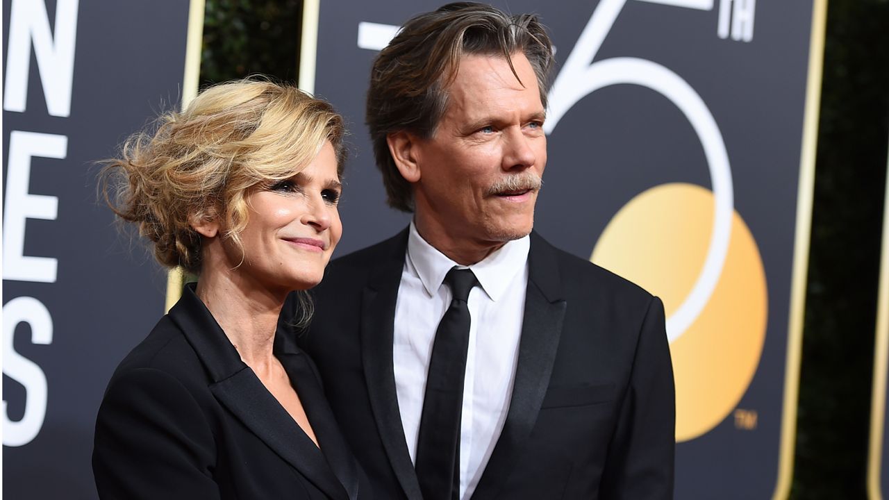 Kyra Sedgwick, left, and Kevin Bacon arrive at the 75th annual Golden Globe Awards at the Beverly Hilton Hotel on Sunday, Jan. 7, 2018, in Beverly Hills, Calif. (Photo by Jordan Strauss/Invision/AP)