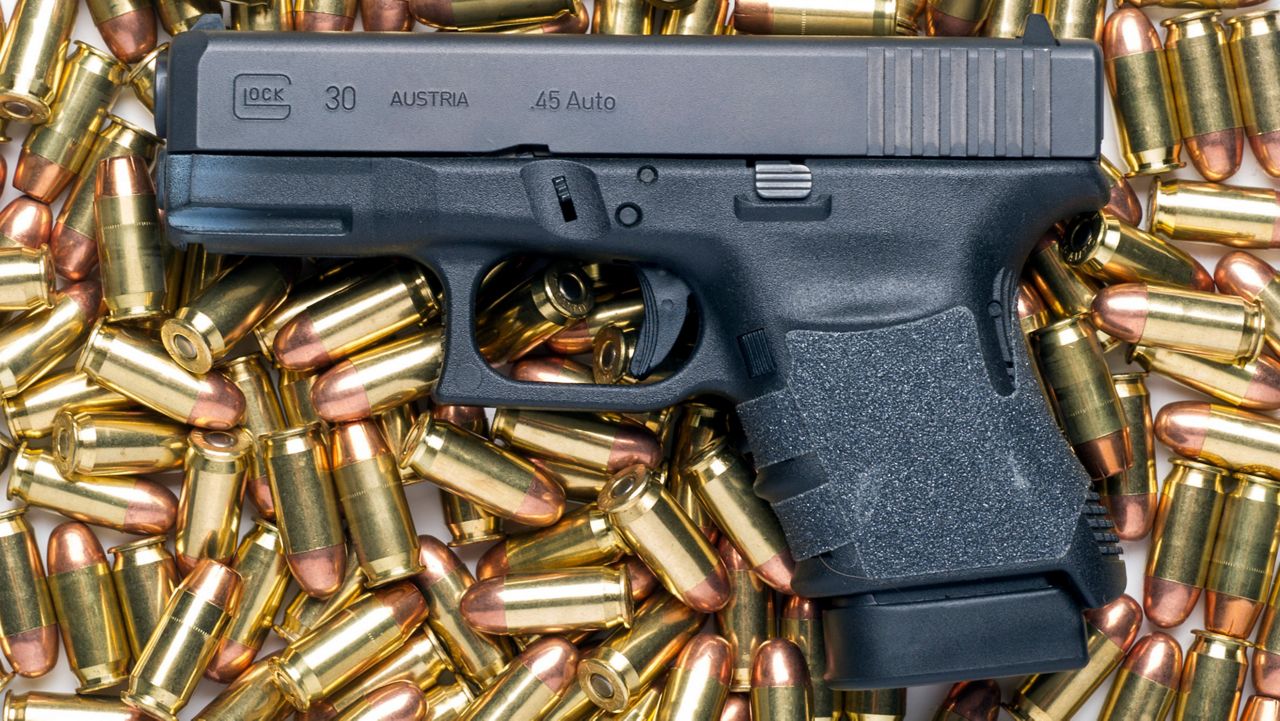 Glock 9mm and bullets (Cliff Owen/AP)