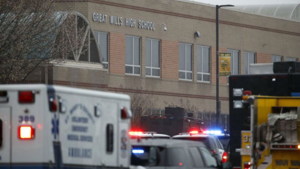Deputies, federal agents and rescue personnel, converge on Great Mills High School, the scene of a shooting, Tuesday morning, March 20, 2018 in Great Mills, Md. The shooting left at least three people injured including the shooter. (AP Photo/Alex Brandon )