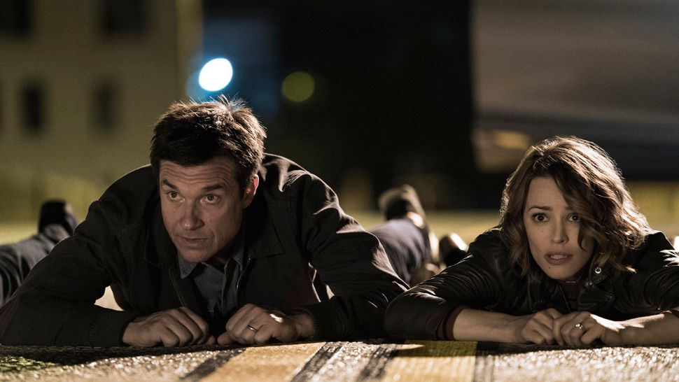 (L-R) JASON BATEMAN as Max and RACHEL McADAMS as Annie in New Line Cinema's comedy "GAME NIGHT," a Warner Bros. Pictures release. (Photo credit: Hopper Stone)