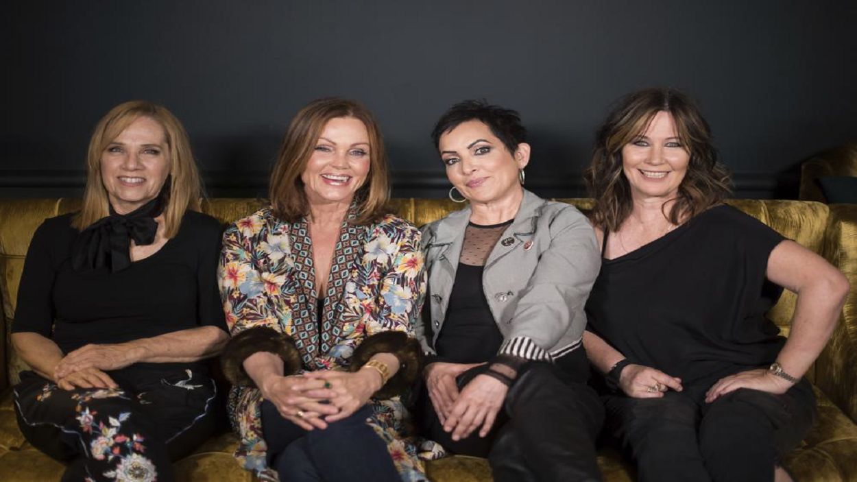 FILE - The Go-Go's band members, from left, Charlotte Caffey, Belinda Carlisle, Jane Wiedlin and Kathy Valentine pose together at the Hudson Theatre during previews for the new Broadway musical "Head Over Heels" on July 12, 2018, in New York. (Photo by Charles Sykes/Invision/AP, File)