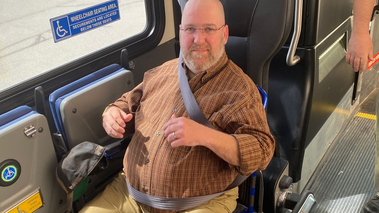 Adam Bellcorelli says he's a big fan of the new technology that allows those with mobility devices complete independence while riding Oshkosh buses.