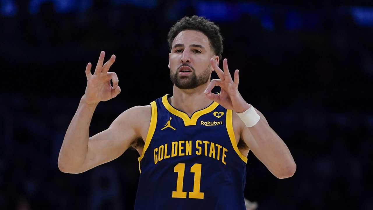 Golden State Warriors guard Klay Thompson gestures after making a 3-point basket against the Los Angeles Lakers during the second half of an NBA basketball game Tuesday, April 9, 2024, in Los Angeles. (AP Photo/Ryan Sun)