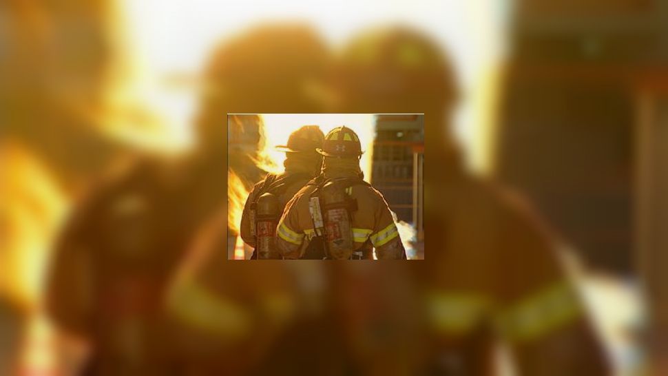Firefighters appear in front of a blaze in this undated file image. (Spectrum News)