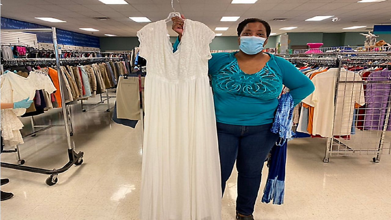 Columbus resident Kelley Veal finds her wedding dress at Goodwill's free wedding dress giveaway.