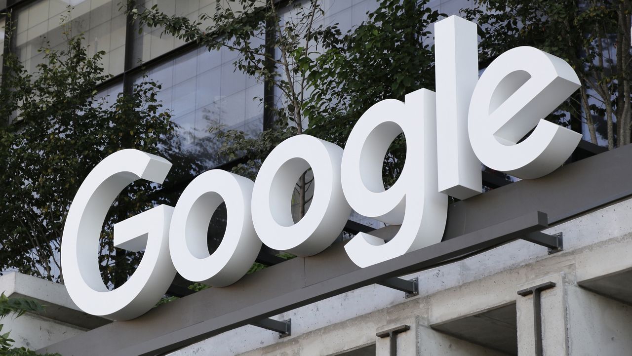 The Google sign is shown over an entrance to the company's new building in New York on Sept. 6, 2023. (AP Photo/Peter Morgan)