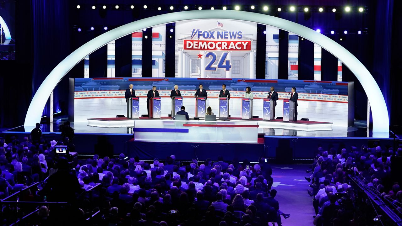 Republican presidential candidates stand at their podiums during a Republican presidential primary debate hosted by FOX News Channel Wednesday, Aug. 23, 2023, in Milwaukee. (AP Photo/Morry Gash)