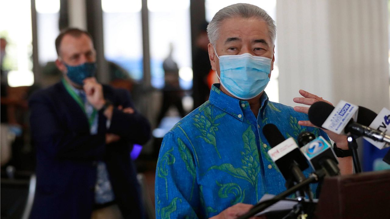 In this Oct. 15, 2020, file photo, Hawaii Gov. David Ige speaks at a news conference at the Daniel K. Inouye International Airport in Honolulu. (AP Photo/Marco Garcia, File)