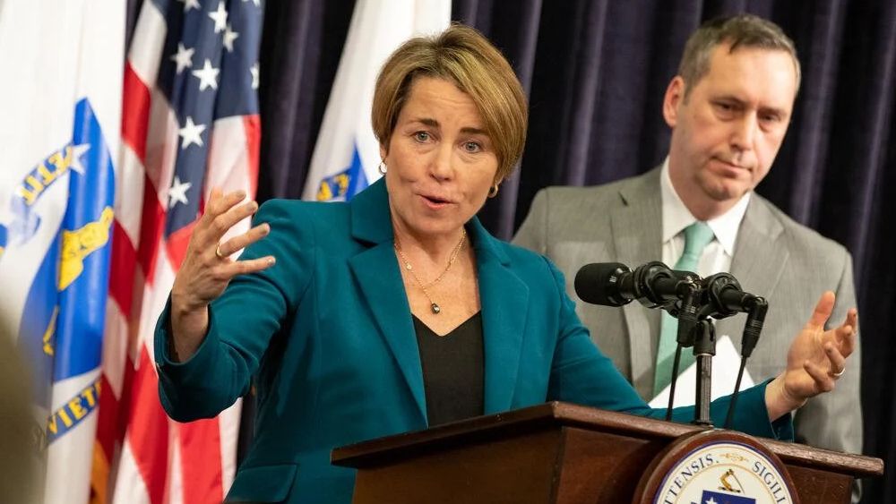 Gov. Maura Healey talks through details of her fiscal 2024 budget proposal at a State House news conference on March 1, 2023, which included her budget chief Secretary Matthew Gorzkowicz (right). (State House News Service/Sam Doran)