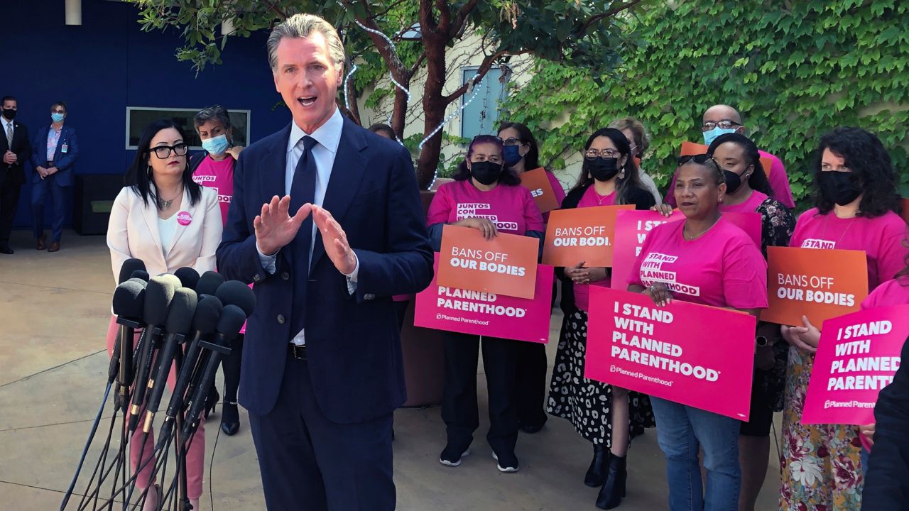 California Gov. Gavin Newsom talks at a news conference with workers and volunteers on Wednesday, May 4, 2022, at a Planned Parenthood office near downtown Los Angeles. (AP Photo/Michael R. Blood)