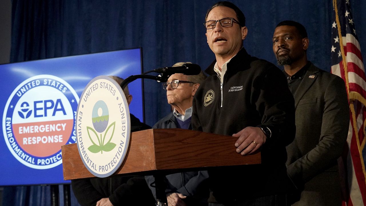 Ohio Gov. Mike DeWine (left) and Pennsylvania Gov. Josh Shapiro (center). (AP Photo)