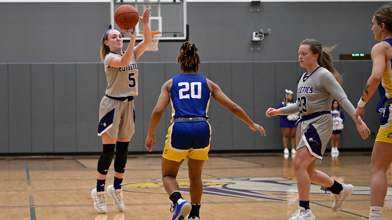 University Health Sciences and Pharmacy guard Grace Beyer (5) shoots during an NAIA college basketball game