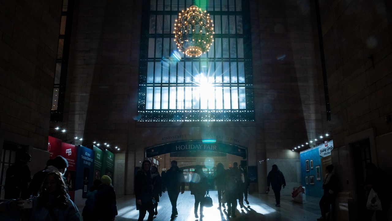 Travelers walk through Grand Central Terminal in New York on Thursday, Dec. 21, 2023.