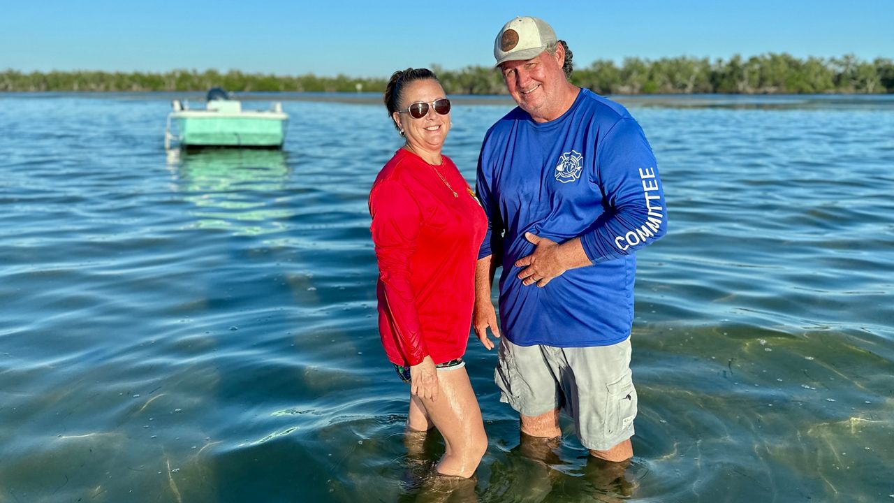 Captain D of Day Trippin Tours, along with husband and fellow captain Ricky Gullett in Terra Ceia Bay. (Spectrum News/Bobby Collins)