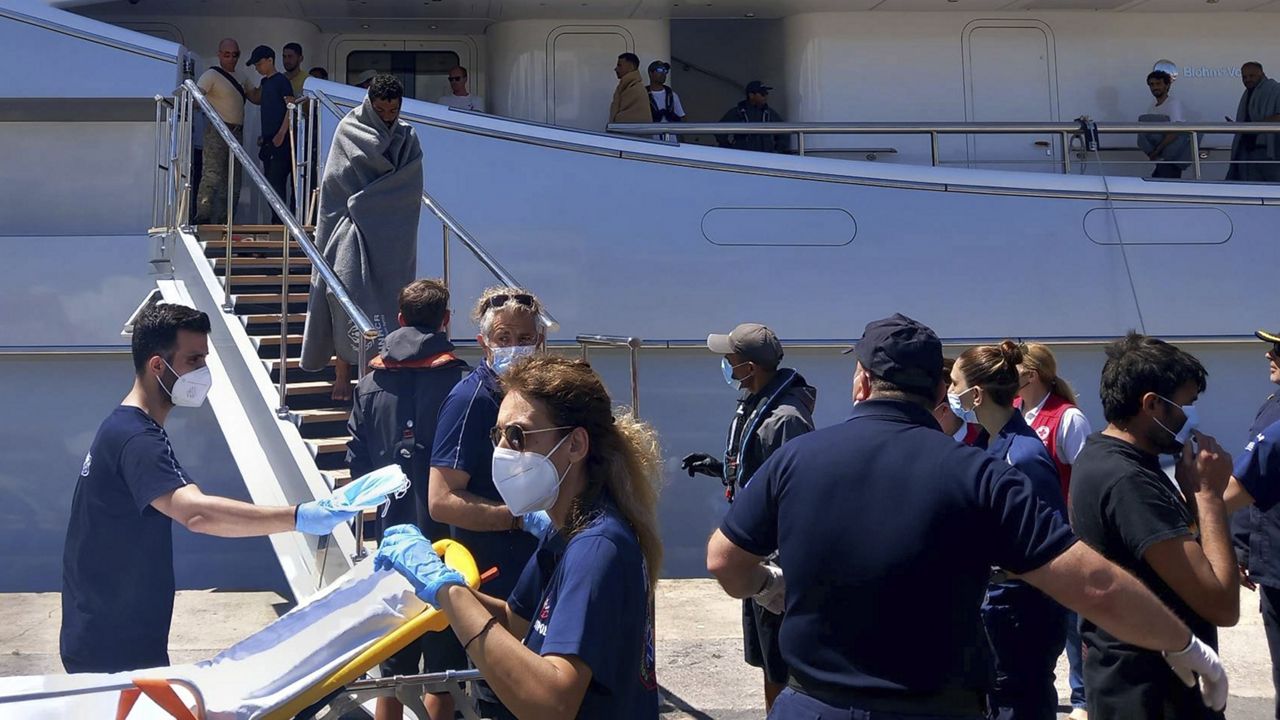 Survivors arrive by yacht Wednesday after a rescue operation at the port in Kalamata town, about 150 miles southwest of Athens. (www.argolikeseidhseis.gr via AP)
