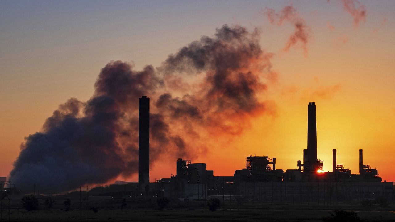 In this July 27, 2018, file photo, the Dave Johnson coal-fired power plant is silhouetted against the morning sun in Glenrock, Wyo. (AP Photo/J. David Ake, File)
