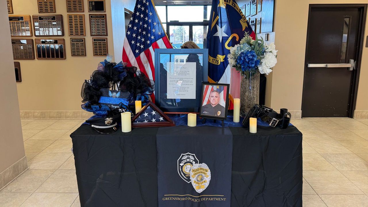 A display at the Greensboro Police Department honors Officer Michael Horan. (Spectrum News 1/Zyneria Byrd)