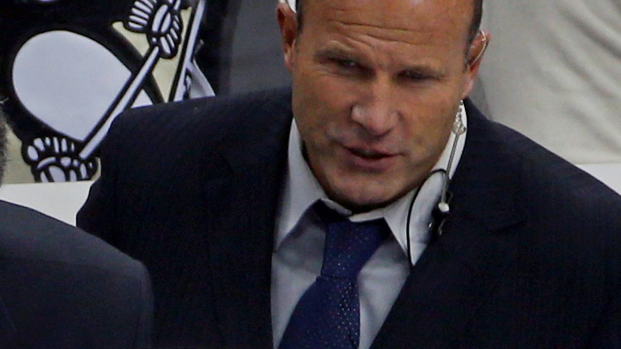 New York Islanders assistant coach Greg Cronin is shown during the third period of an NHL hockey game on Oct. 18, 2014, against the Pittsburgh Penguins. The Anaheim Ducks have hired veteran NHL assistant and AHL head coach Greg Cronin to be their new head coach. (AP Photo/Gene J. Puskar)