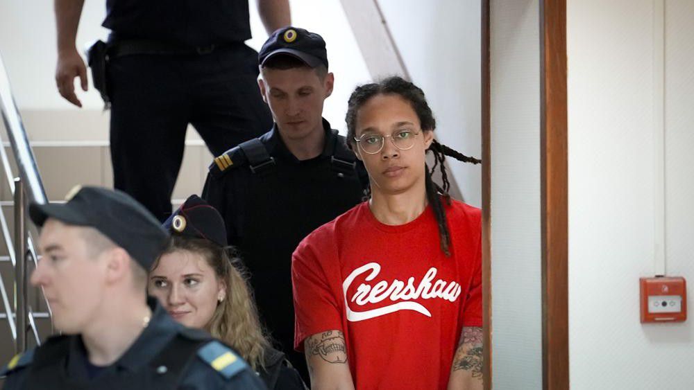 WNBA star and two-time Olympic gold medalist Brittney Griner is escorted to a courtroom for a hearing, in Khimki outside Moscow, Russia, Thursday, July 7, 2022. Griner on Thursday pleaded guilty to drug possession and smuggling during her trial in Moscow but said she had no intention of committing a crime, Russian news agencies reported. (AP Photo/Alexander Zemlianichenko)