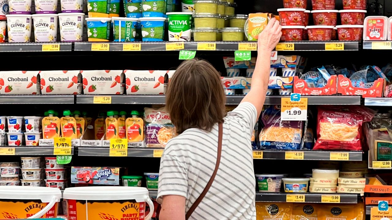 people shopping at a grocery store