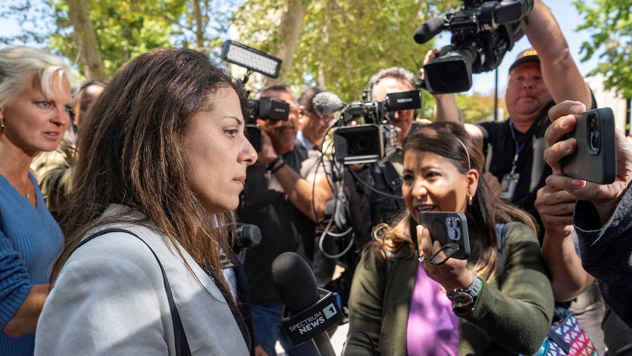 Nancy Iskander, left, pauses to talk to the media as she leaves Van Nuys Courthouse on Monday, June 10, 2024, in Van Nuys, Calif., after attending the sentencing hearing in the murder trial of Rebecca Grossman, who is charged in the deaths of her two sons, Mark, 11, and Jacob, 8. Grossman was sentenced Monday to 15 years to life in prison for the hit-and-run deaths of the two young brothers in a crosswalk. (AP Photo/Damian Dovarganes)