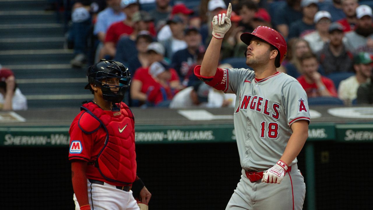 Cleveland Guardians' Bo Naylo, left, looks on as Los Angeles Angels' Nolan Schanuel (18) gestures after hitting a solo home run off Guardians starting pitcher Tanner Bibee during the third inning of a baseball game in Cleveland, Friday, May 3, 2024. 