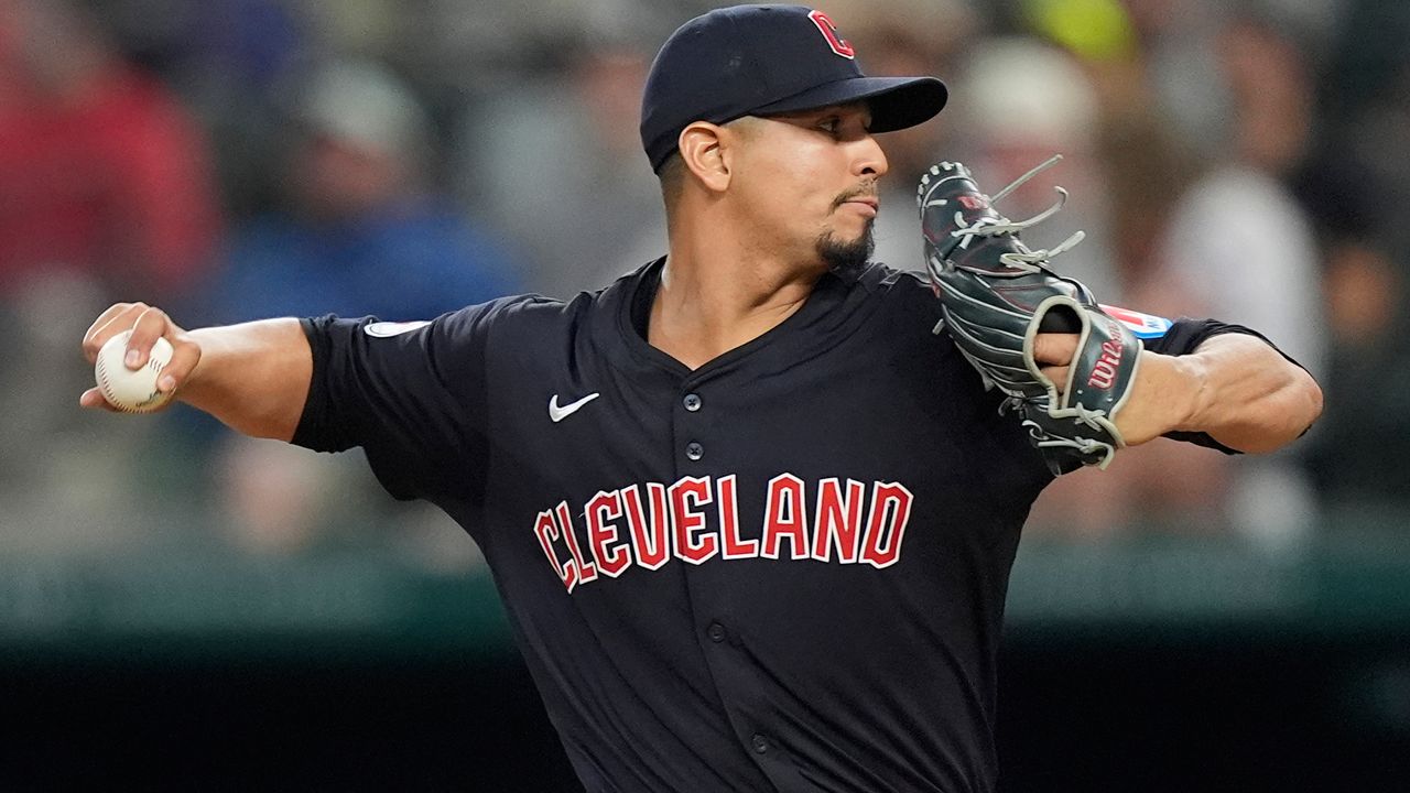 Cleveland Guardians pitcher Carlos Carrasco throws during the first inning of a baseball game against the Texas Rangers in Arlington, Texas, Wednesday, May 15, 2024. (AP Photo/LM Otero)