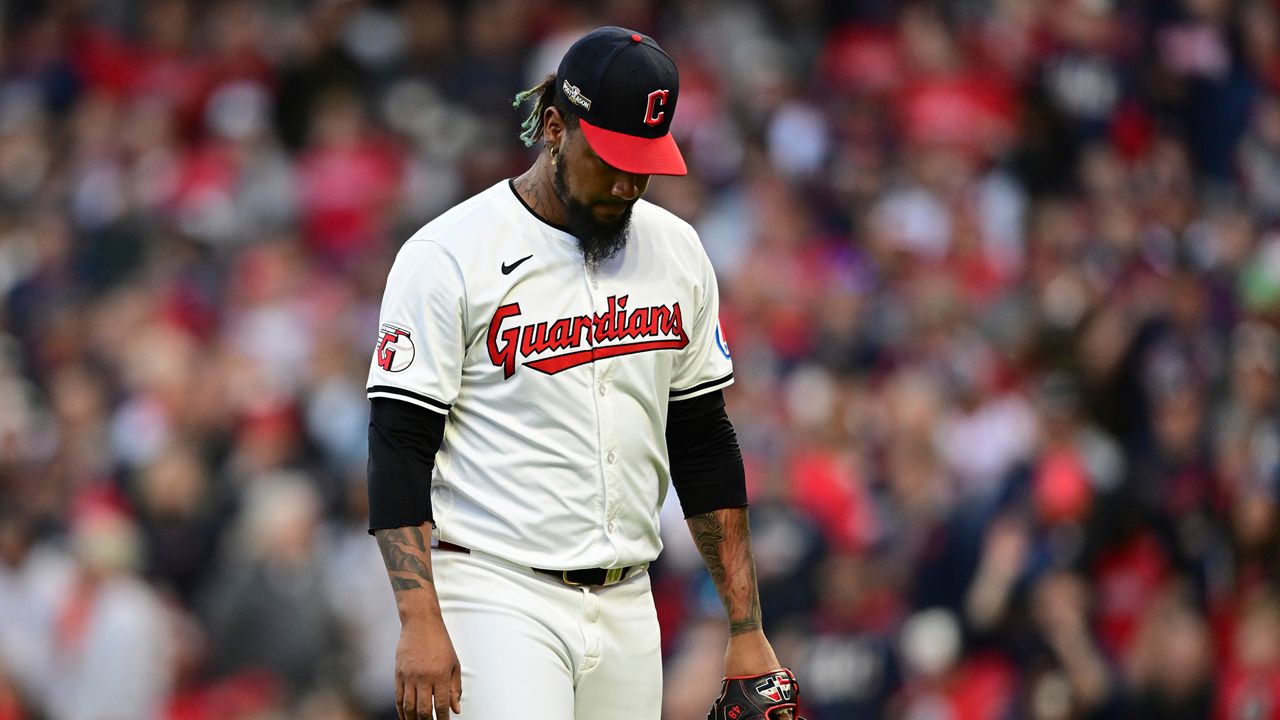 Cleveland Guardians pitcher Emmanuel Clase walks off the field after being taken out of the game in the ninth inning during Game 2 of baseball's AL Division Series against the Detroit Tigers, Monday, Oct. 7, 2024, in Cleveland. (AP Photo/David Dermer)