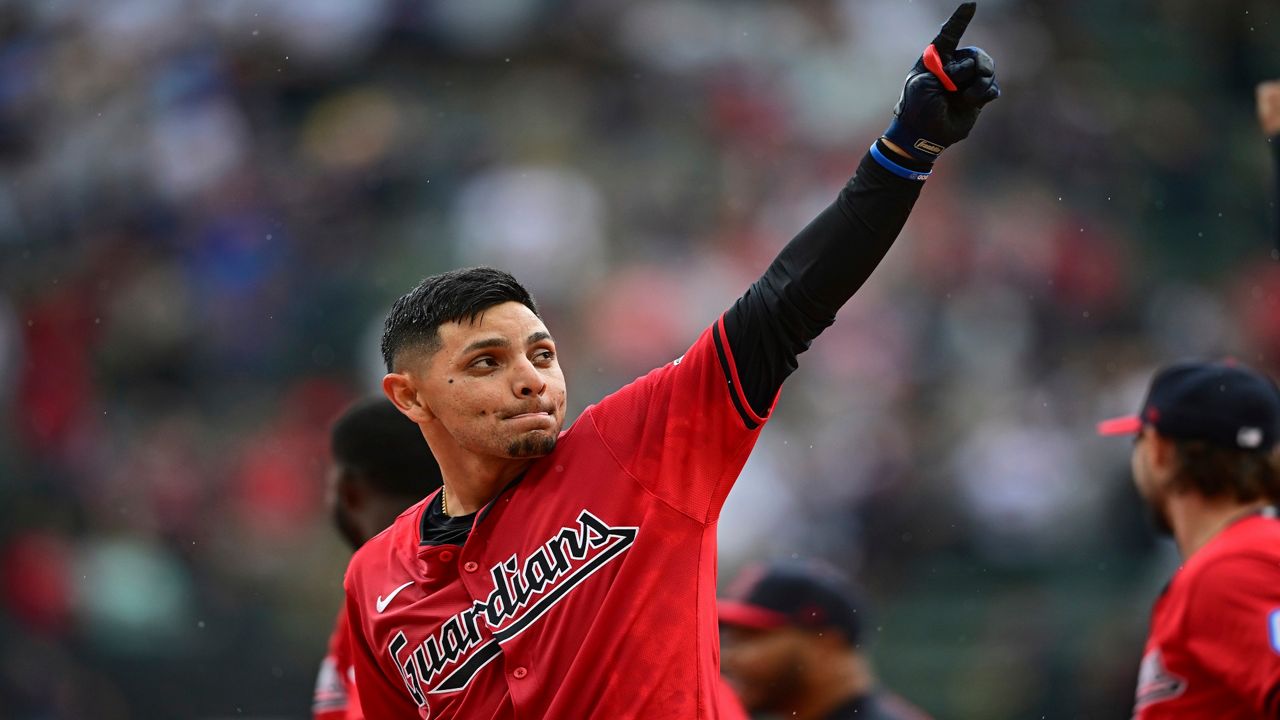 Cleveland Guardians' Andres Gimenez celebrates after hitting a walkoff sacrifice fly in the 10th inning of a baseball game against the New York Yankees, Sunday, April 14, 2024, in Cleveland. (AP Photo/David Dermer)