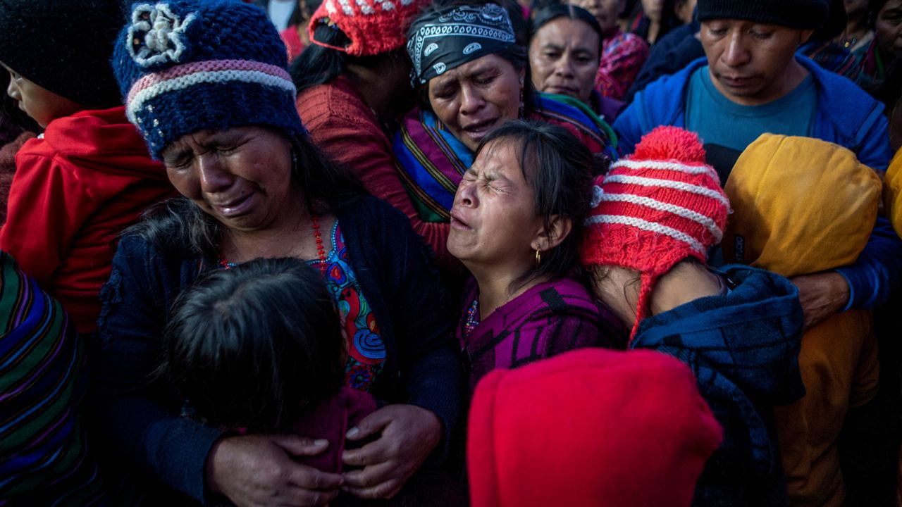 Relatives react as the remains of Pascual Melvin Guachiac Sipac arrives to his hometown in Tzucubal, Nahuala, Guatemala, Friday, June 15, 2022. The 13-year-old was among a group of migrants who died of heat and dehydration in a trailer-truck abandoned by smugglers on the outskirts of San Antonio, Texas, on June 27. (AP Photo/Oliver de Ros)