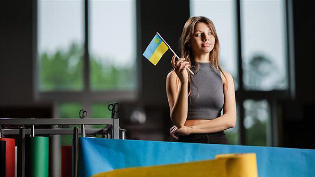   Botezatt waving the Ukranian flag (Guilford County Schools)