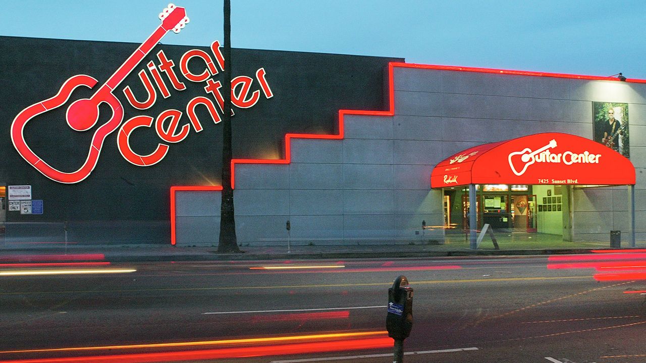 The Guitar Center store is seen in a file photo from Feb. 17, 2004, on Sunset Boulevard in Los Angeles.  (AP Photo/Damian Dovarganes, File)