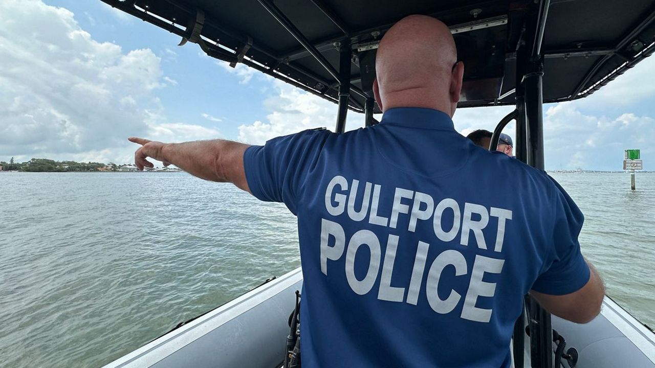 Gulfport Marine Patrol Officer Kevin Chastain delivering boater safety precautions to anchored vessels (Erica Riggins / Spectrum News)