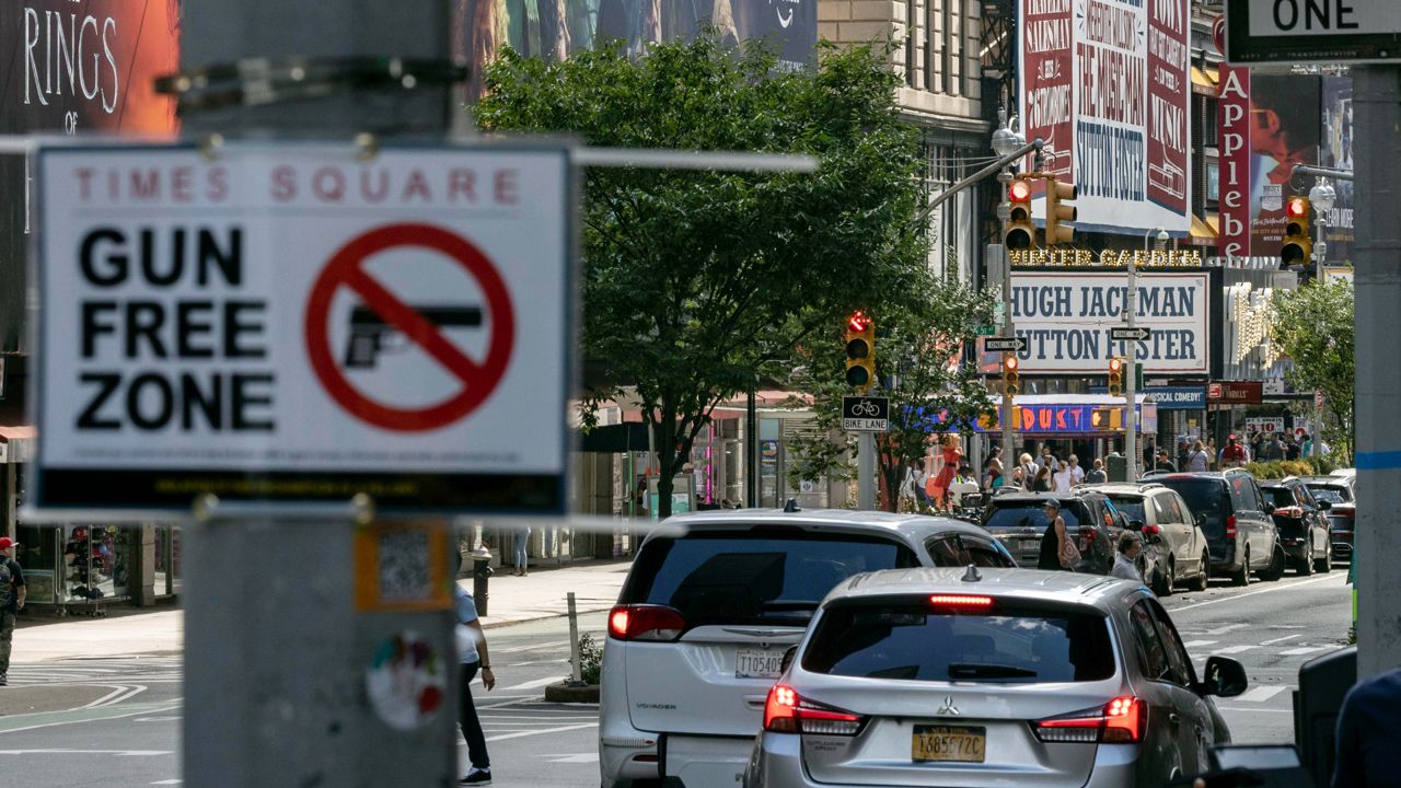 Signs denoting the gun-free area around Times Square went up earlier this month, even as the law prohibiting firearms there is challenged in federal courts. (AP Photo/Yuki Iwamura, File)