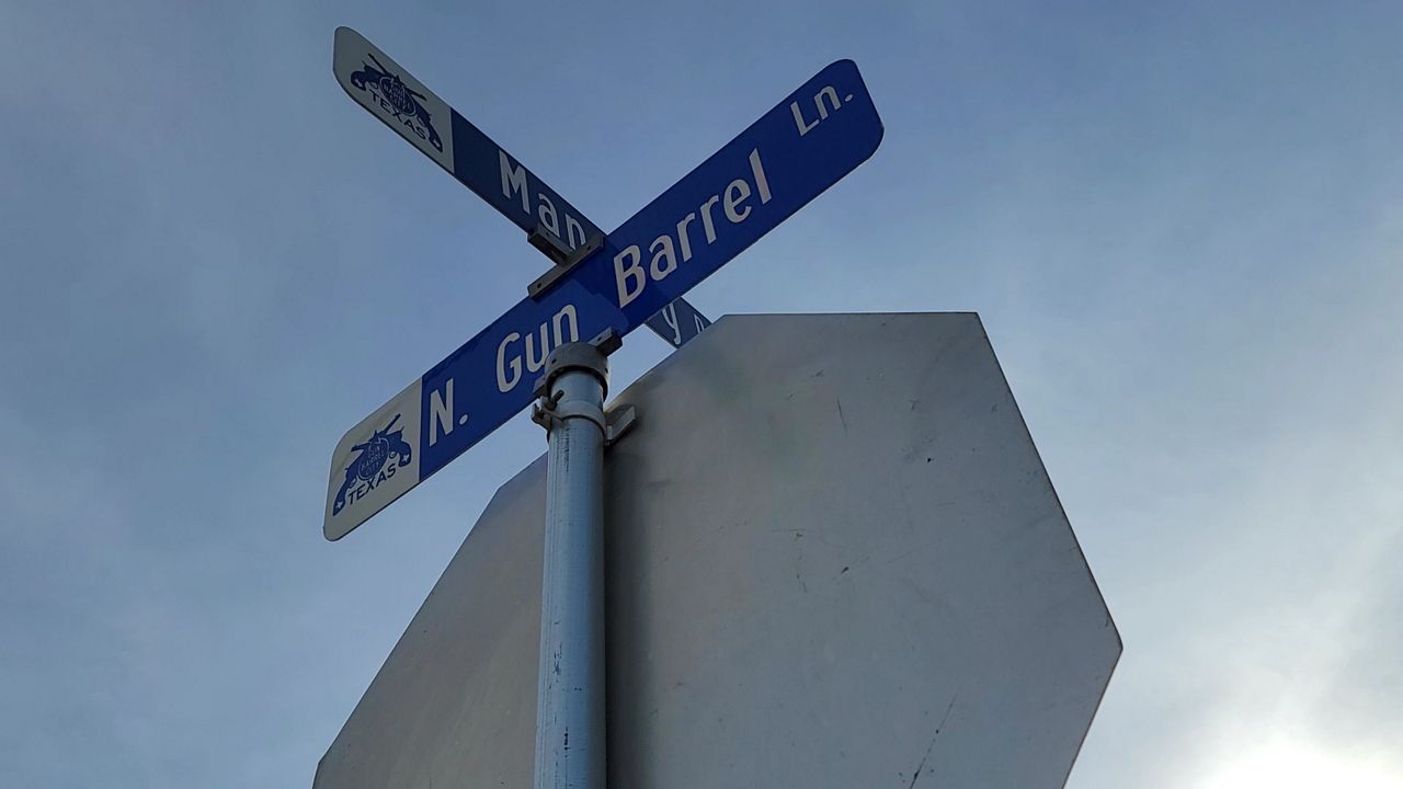 A sign for Gun Barrel City's most famous roadway, Gun Barrel Lane, appears in this image from June 2021. (Spectrum News 1/Agustin Garfias)