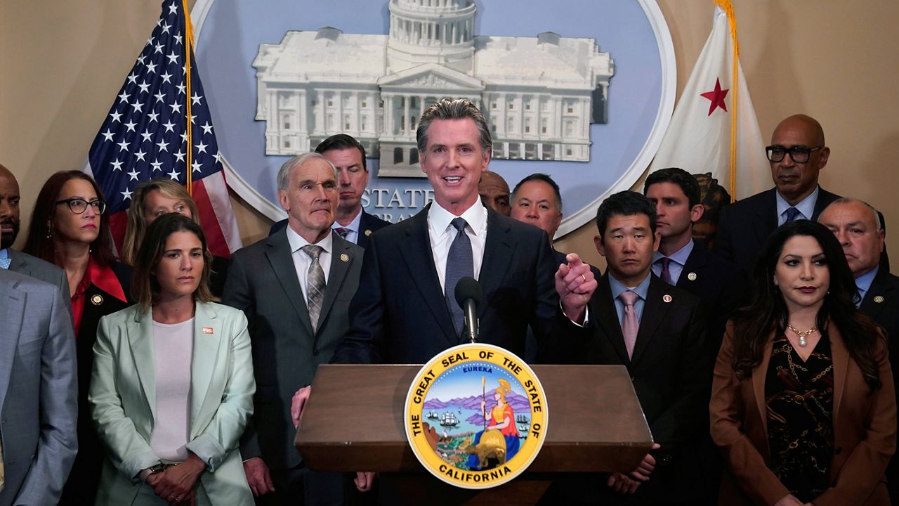 California Gov. Gavin Newsom discusses the recent mass shooting in Texas, during a news conference in Sacramento, Calif., Wednesday, May 25, 2022. Flanked by lawmakers from both houses of the state legislature, Newsom said he is ready to sign more restrictive gun measures passed by lawmakers.(AP Photo/Rich Pedroncelli)