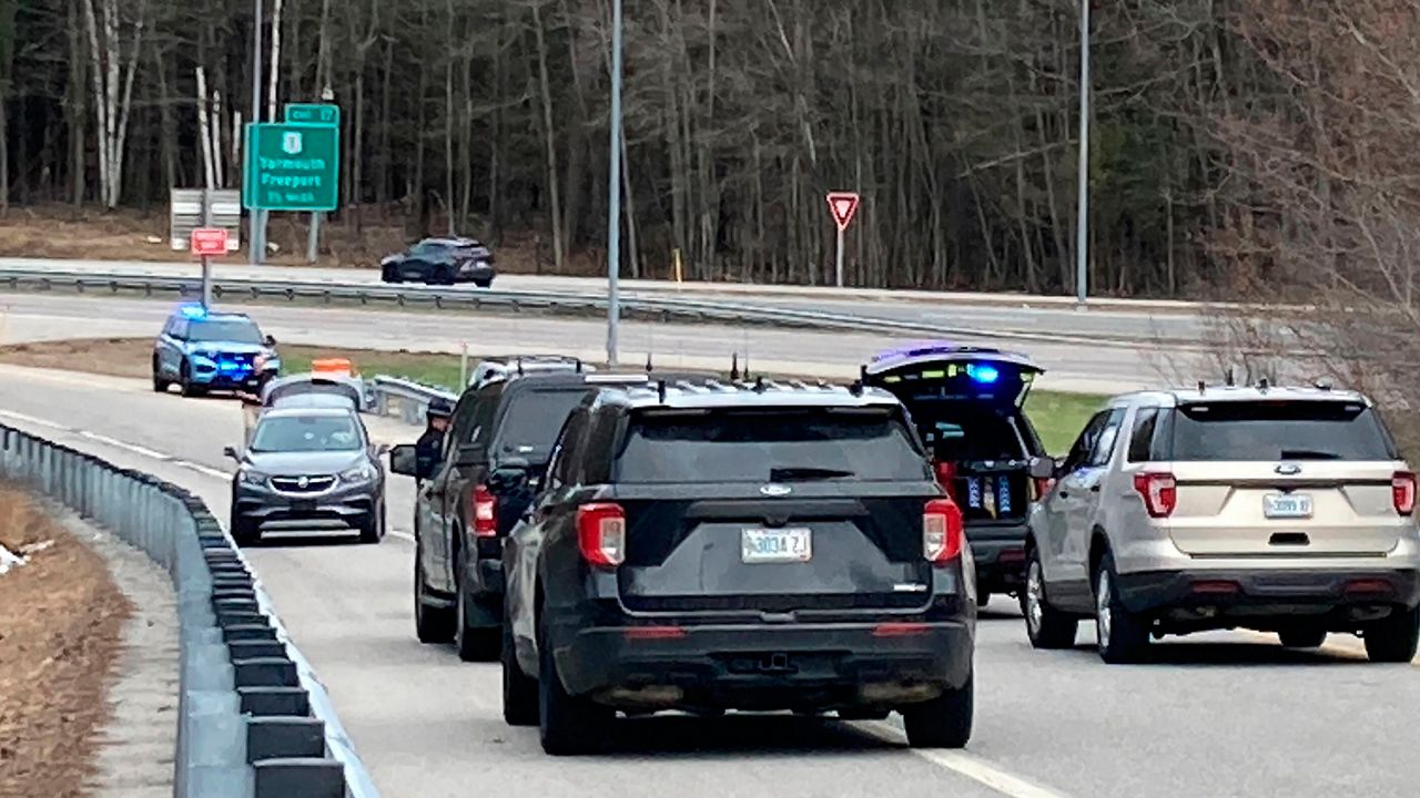 Vehicles are stopped on a highway at a scene where people were injured in a shooting on Interstate 295 in Yarmouth, on Tuesday, April 18. (AP Photo/Patrick Whittle)
