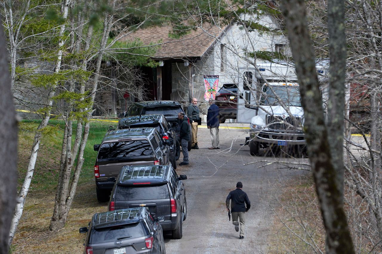 Investigators work at the scene of a deadly shooting on Tuesday, April 18, in Bowdoin. (AP Photo/Robert F. Bukaty)
