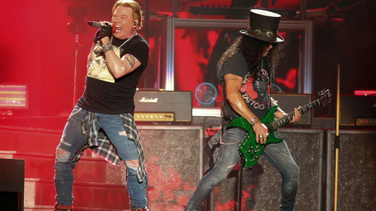 Singer Axl Rose (left) and guitarist Slash (right) from Guns N' Roses. (Photo by Jack Plunkett/Invision/AP) 