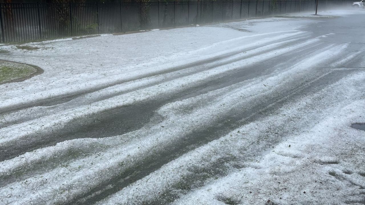 Hail coating the road like snow in West Melbourne on Wednesday. (Picture courtesy: Dan Jacobs)